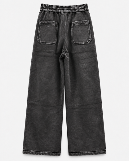 Pants Negro Acid Wash - vista trasera sobre fondo neutro