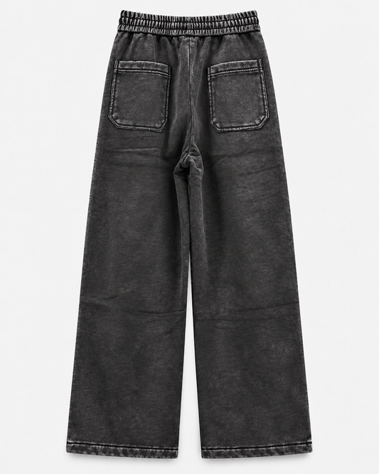 Pants Negro Acid Wash - vista trasera sobre fondo neutro